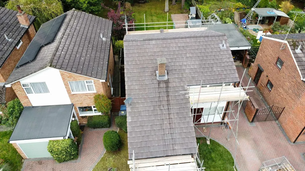 Overhead view of a grey roof between neighbouring houses